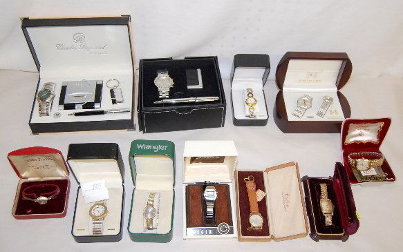 11 Wrist Watches in Original Boxes: 11 Wrist Watches in Original Boxes: They are Fondini, Charles Raymond, Calvin Hill, Wrangler, Oleg Cassini, Lucerna 17J, Bulova, Gruen, Seth Thomas, Faberge and Elgin; some are new and some are old. N