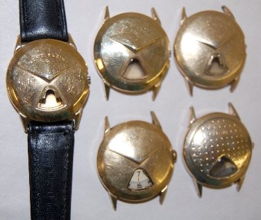 5 Elgin Chevron Style Wrist Watch Cases: 5 Elgin Chevron Style Wrist Watch Cases: 3 are Lord Elgin and plain; 1 is the golf ball type; 1 has a movement but is missing the crystal. All sell as is, where is.