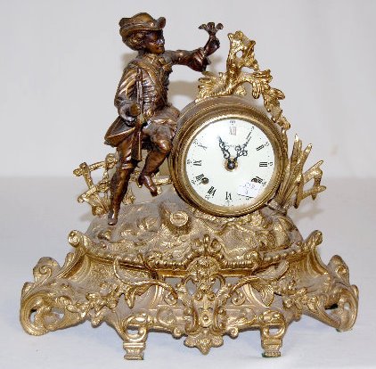 German Bronze Mantel Clock, Hunter w/Rifle: German Bronze Mantel Clock, Hunter w/Rifle: Numbered 130-070, the porcelain dial is marked "Imperial" and "Made in Italy". The FHS Germany movement has two hammers that strike a single brass cup bell 