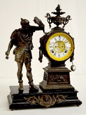 Ansonia "Attila" Statue Clock: Ansonia "Attila" Statue Clock: With an 8 day with 1/2 hour gong strike movement and a visible escapement dial. The clock is running and striking at this time. Dial - 6" Diameter; 21 1/2" Tall x 15" Wi