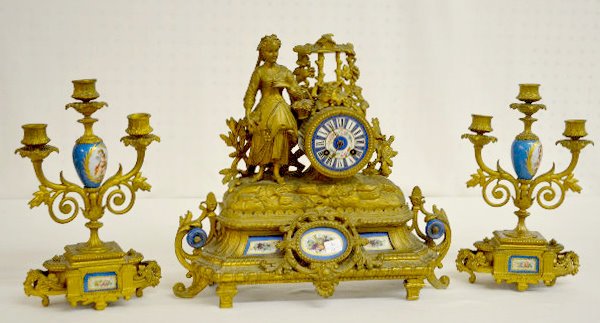 LEP Jap & Co. 3 Piece Clock Garniture Set: LEP Jap & Co. 3 Piece Clock Garniture Set: With bell strike movement, No. 418 and a porcelain dial. The white metal case with Sevres style porcelain inserts is topped with a woman, grapes and an oak b