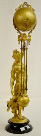 Ansonia "Huntress" Ball Swinging Clock: Ansonia "Huntress" Ball Swinging Clock: With an 8 day Time movement. There is an all gold statue, the clock and pendulum on the original base. The clock is running at this time. 25" Tall Sells as is, 