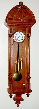 3 Weight Vienna Wall Clock: 3 Weight Vienna Wall Clock: In a carved case with a 2 piece porcelain dial and brass trim, pendulum and weights. Not tested Case - 64" Long Sells as is, where is. **Please note, this items ships F.O.B