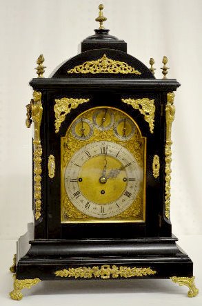 Triple Fusee 8 Bell Musical Bracket Clock: Triple Fusee 8 Bell Musical Bracket Clock: With 1/4 hour strike on 8 bells plus hourly on a cathedral gong. In an ebonized wood case with bronze decorations. The clock is running and striking at this 