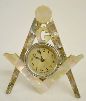 Lux Masonic Emblem Clock w/Mother of Pearl: Lux Masonic Emblem Clock w/Mother of Pearl: The dial is in a free standing wood with abalone and M.O.P. shell overlay emblem of the Masonic Organization. The clock is running at this time. The frame 6