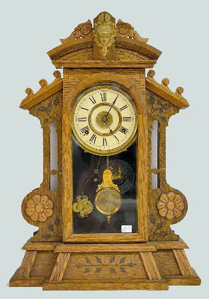Oak New Haven "Corsair" Shelf Clock: Oak New Haven "Corsair" Shelf Clock: With an 8 day T&S with alarm, spring driven movement. The paper dial is unmarked. A pendulum is with the clock. (The clock winds and strikes but does not keep runn