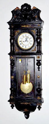 German Ebonized 2 Wt. Wall Regulator Clock: German Ebonized 2 Weight Wall Regulator Clock: With an 8 day T&S movement; an unmarked simulated newer porcelain dial; the 2 weights and pendulum. The case is carved with shell and fruit and has metal