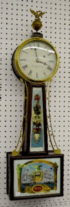 Herschedes Weight Driven Banjo Clock: Herschedes Weight Driven Banjo Clock: TO with a marked movement; a metal dial marked "Bigelow, Kennard & Co., Inc. Boston"; a Hull tablet with an Old Ironsides battle scene; an eagle on ball finial an