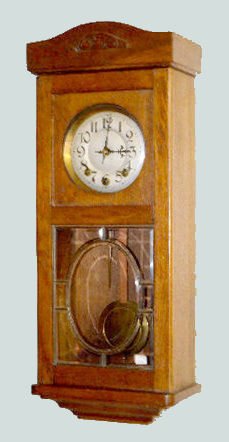 German Leaded Glass Box Clock, Oak Case: German Leaded Glass Box Clock, Oak Case: With an 8 day T&S with chime movement; an unmarked silvered metal dial and the pendulum. Not tested. 30 1/2" Long Sells as is, where is.