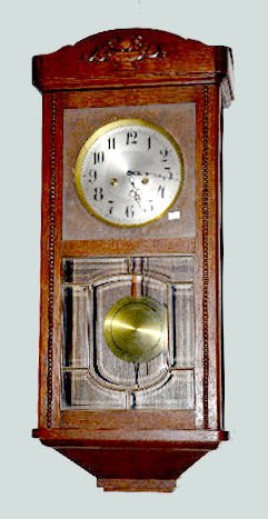 German Oak Hanging Box Clock: German Oak Hanging Box Clock: 8 day T & S; unmarked metal dial; has pendulum and 3 bar strike; leaded glass lower door. Tag above the dial and holding the rods reads "Sirenen Cong". Not tested. 32" Ta