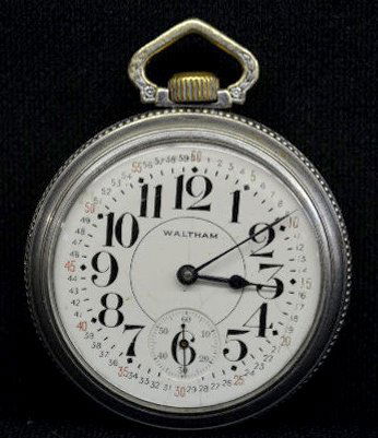 Waltham Vanguard 23 J 18S OF Pocket Watch: Waltham Vanguard 23 J 18S OF Pocket Watch: With Serial No. 12565324; a "Waltham" porcelain dial with seconds bit and an engraved movement. In an Illinois Spartan silveroid case numbered 0874389 with a