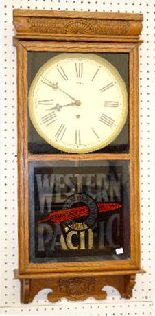 Ingraham "Western Pacific" Oak Adv. Store Clock: Ingraham "Western Pacific" Oak Adv. Wall Clock: With a TO movement; a paper dial marked "Sessions" and a lower door advertising "Western Pacific Feather River Route". The pendulum is with the clock. N