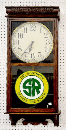 Ingraham "Western Union" Oak RR Adv. Wall Clock: Ingraham "Western Union" Oak RR Adv. Wall Clock: With a TO movement; a paper dial marked "Ingraham"; and a lower glass advertising "The Southern Serves The South - SR". The pendulum and key are with t