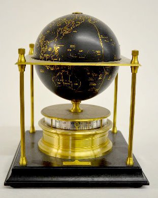 Royal Geographical Society World Clock: Royal Geographical Society World Clock: from England's prestigious Royal Geographical Society; brass and metal with wood base; 1979 on the presentation tag; annular style dial; has original paperwork 
