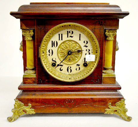Seth Thomas "Adele" Adamantine Mantel Clock: Seth Thomas "Adele" Adamantine Mantel Clock: With a signed T&S movement; an unmarked paper dial; the pendulum and key. The adamantine case has faux ivory columns and lion head decorations. (The clock
