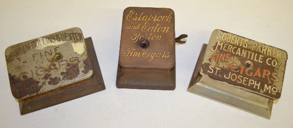 3 Antique Counter Top Advertising Cigar Cutters: 3 Antique Counter Top Advertising Cigar Cutters: 1.) "Estabrook & Eaton": the top reads "Estabrook and Eaton Boston Fine Cigars". The base reads "The Brunhoff Co. Cinti. O. Pat. Mar. 5, 01". (Although