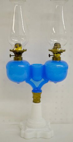 Antique Wedding Lamp, Ripley Blue Opaline: Antique Wedding Lamp, Ripley Blue Opaline: The blue opaline double font with central match holder is connected to a white milk glass stem and base. The burners are marked Miller Co. - USA and are hing