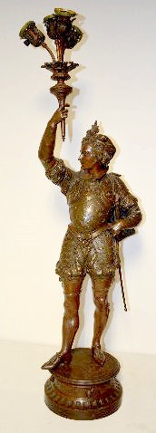 Antique Shakespearean Figural Newel Post Lamp: Antique Shakespearean Male Figural Newel Post Lamp: Made of white metal with 4 sockets with blue shades. He is dressed in mid-18th Century outfit with a sword. 54" Tall Sells as is, where is. **Please