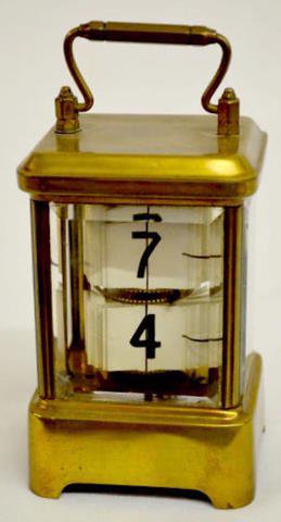 Plato Digital Brass Carriage Clock: Plato Digital Brass Carriage Clock: (The two beveled panels have chips. The time indicator is loose inside the case.) Not tested. 6" Tall Sells as is, where is.