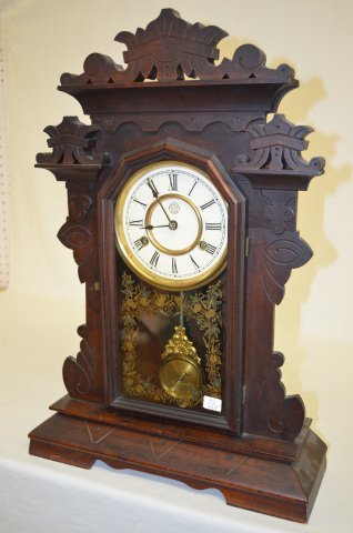 New Haven "Coquette" Black Walnut Clock: New Haven "Coquette" Black Walnut Clock: With stenciled glass. (There may be minor, as expected, scuffs and mars to the case.) Not tested. Sells as is, where is.