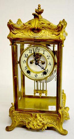 Antique New Haven Crystal Regulator Clock, "Thoreau": Antique New Haven Crystal Regulator Clock, "Thoreau": In a metal polished gold plated case with beveled glass and an 8 Day porcelain dial with open escapement and a faux mercury pendulum. (There is a 