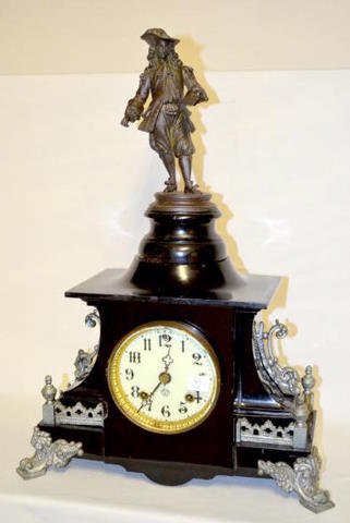 Ansonia Black Iron 8 Day T&S Clock: Ansonia Black Iron 8 Day T&S Clock: Nice statue on top; great porcelain dial. Sells as is, where is. Please note, this item sells F.O.B., which means you the buyer must make your own packing and shipp