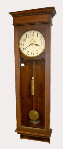 New Haven Oak One-Weight Wall Clock: New Haven Oak One-Weight Wall Clock: Carved case; brass trim with seconds bit; time only; good metal beat scale. 64"T (Some dents to trim, minor scuffs to case.) Sells as is, where is. Please note, th