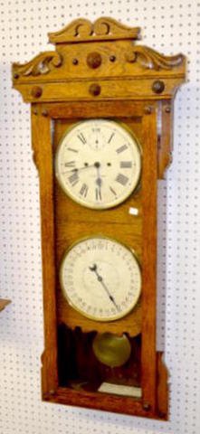 Oak New Haven 30-Day Calendar Clock: Oak New Haven 30-Day Calendar Clock: Wall model; double dial; full signed; brass trim; seconds bit. 45"T Sells as is, where is. Please note, this item sells F.O.B., which means you the buyer must make
