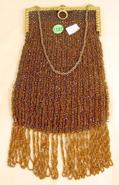 Vintage Brown Beaded Ladies Purse NR: Vintage brown beaded purse with gold colored plated frame (Some minor losses to exterior, 1 1/2" section needs re-sewn to frame) 8" T x 6 3/4" W plus chain handle