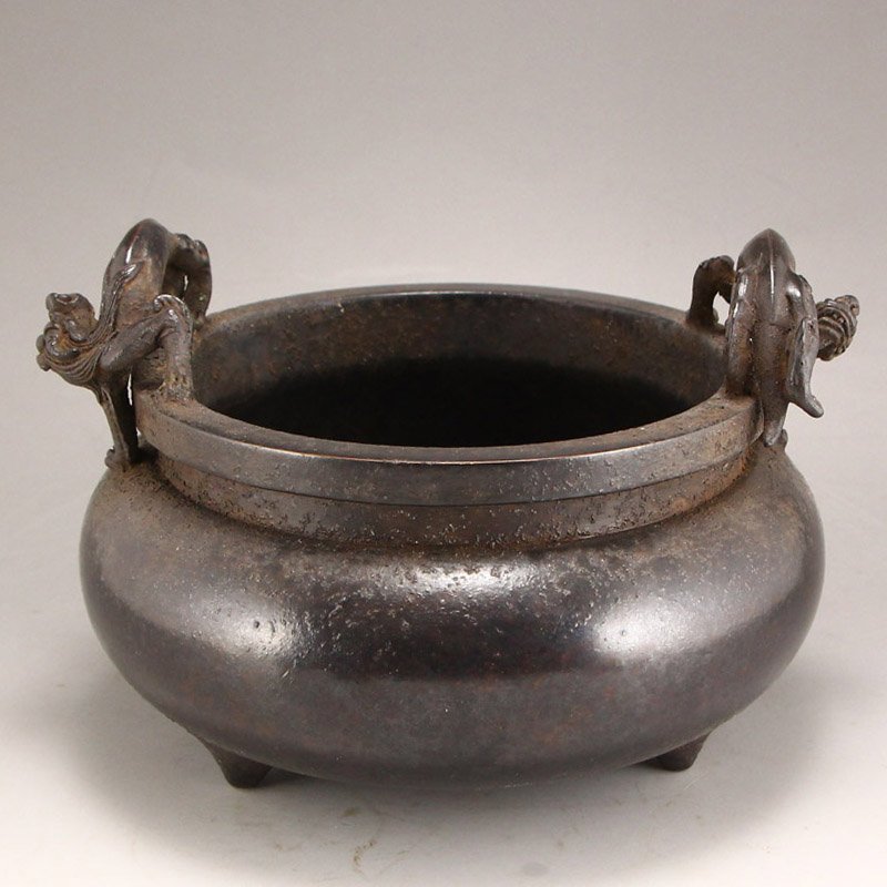 Ming Dynasty Red Copper Double Ears Incense Burner: Ming Dynasty red copper incense burner with Xuan De mark. This wide burner stands on three legs and is supported by double ears in the form of dragons. Dimension: 180x180x125(mm) 7.09x7.09x4.92(inches