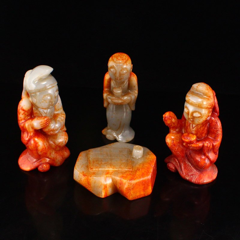 Vintage Chinese Hetian Jade Figures Statue: Vintage Hetian jade figures statue set. Each piece shares a marbled color palette of deep red, bright orange, and subtle light grey. Each figure takes a different pose but the set as a whole sets a tr