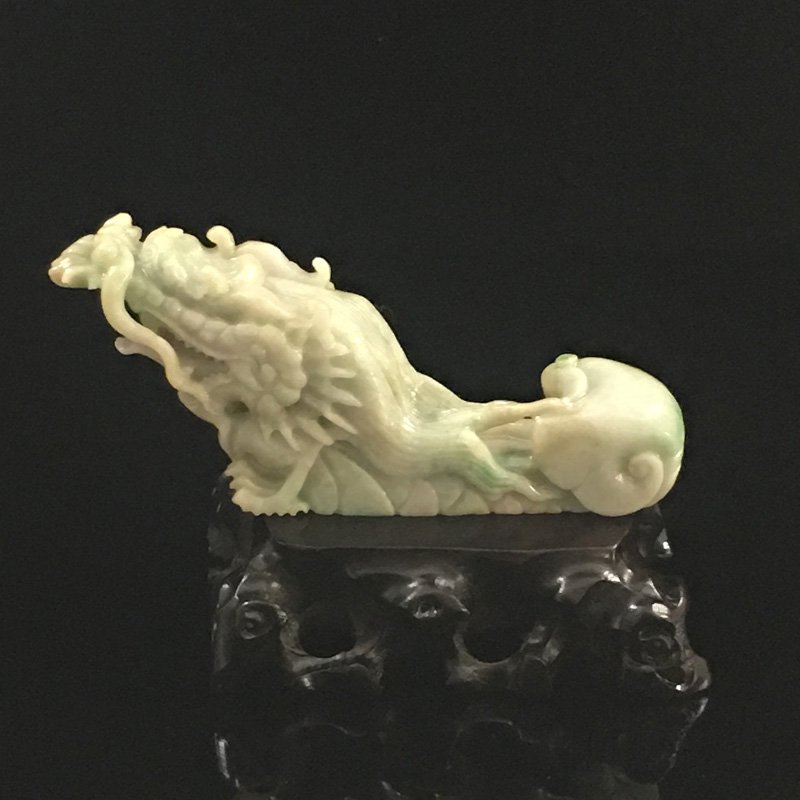 Natural Jadeite/jade Statue - Fortune Dragon: Natural Jadeite/jade Statue - Fortune Dragon Dimension: 131 x 30 x 58(mm) 5.16 x 1.18 x 2.28(inches) Weight: 0.58 lbs/265 g The wooden stand no included.
