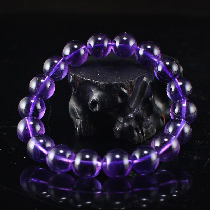 11 MM Natural Amethyst Beads Bracelet: 11 MM Natural Amethyst Beads BraceletDimension: 11(mm) 0.43 (inches) Weight: 0.09 lbs/40 g The wooden stand no included.