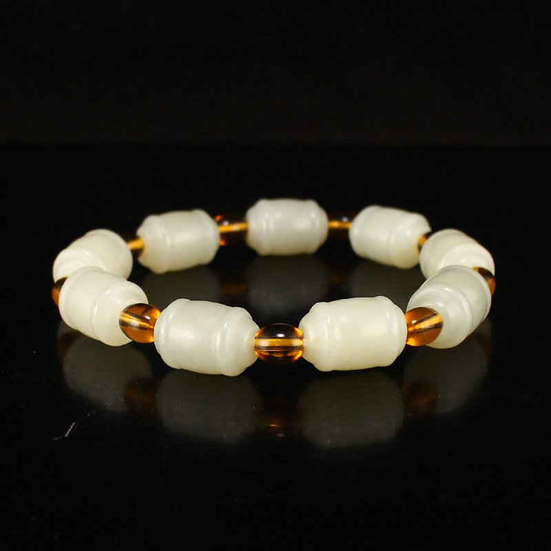Chinese Natural Hetian Jade Lucky Beads Bracelet: Chinese Natural Hetian Jade Lucky Beads Bracelet Dimension: 16 x 11(mm) 0.63 x 0.43(inches) Weight: 0.1 lbs/44 g The wooden stand no included.