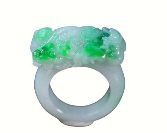 Exquisite Jadeite Carved Phoenix Thumb Ring: Exquisite Jadeite Carved Phoenix Thumb RingDimension: 14 x 11 (mm) 0.55 x 0.43 (inches)