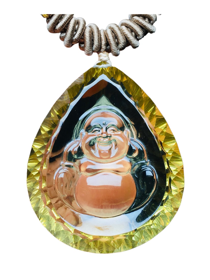 Natural Yellow Crystal Hand-Carved Buddha Pendant w Laughing Buddha: Natural Yellow Crystal Hand-Carved Buddha Pendant w Laughing BuddhaDimension: 50 x 41 x 13 (mm) 1.97 x 1.61 x 0.51 (inches)