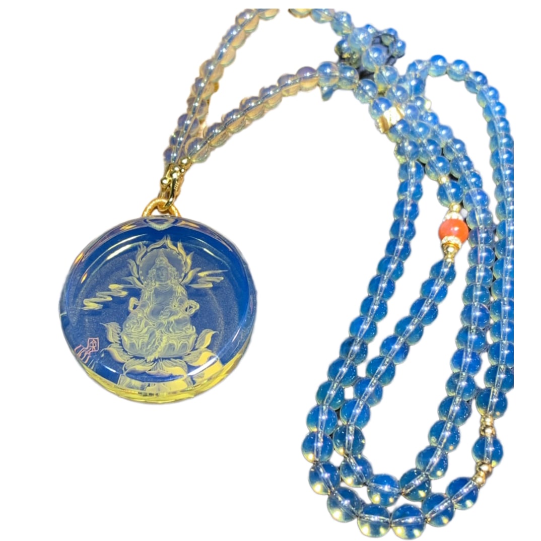 Blue Amber Hand-Carved Figure Pendant w Yellow Jambhala: Blue Amber Hand-Carved Figure Pendant w Yellow JambhalaDimension: 36.7 x 9.9 (mm) 1.44 x 0.39 (inches) Weight: 0.02 lbs/ 10.05 g