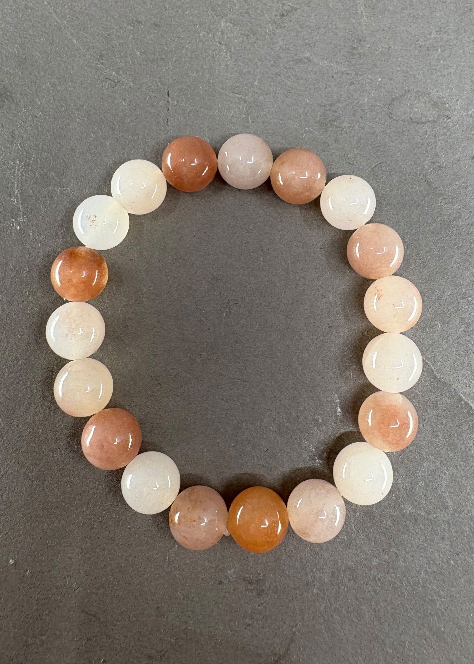 Natural Peach Blossom Jade Beads Bracelet: Natural Peach Blossom Jade Beads Bracelet Dimension: 10 (mm) 0.39 (inches)Weight: 0.06 lbs/ 29.09 g