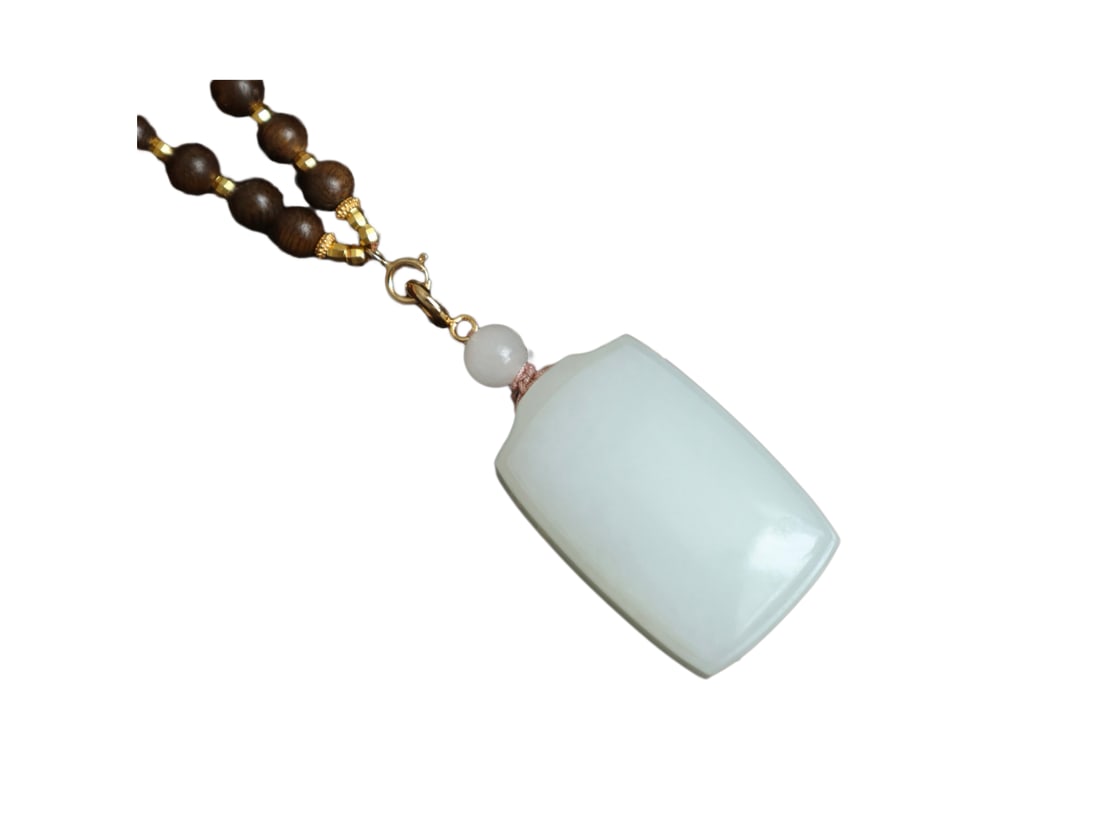 Natural White Hetian Jade Hand-Carved Lucky Pendant w Hand Woven Chenxiang Wood Beads Necklace: Natural White Hetian Jade Hand-Carved Lucky Pendant w Hand Woven Chenxiang Wood Beads NecklaceDimension: 33 x 20.8 x 14.4 (mm) 1.30 x 0.82 x 0.57 (inches)