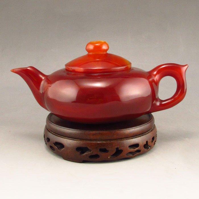 Superb Color Hand Carved Brazil Red Agate Teapot w Lid: Superb Color Hand Carved Brazil Red Agate Teapot w LidDimension: 160*100*70(mm) 6.30*3.94*2.76(in) Weight 0.92 lbs/416g Agate is a code, Ma Nao, horse brain, is a kind of mineral chalcedony class, is