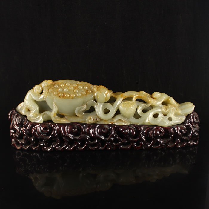 Chinese Hetian Jade Statue - Fortune Kid & Lotus Flower: Superb Chinese Natural Hetian Jade Statue - Fortune Kid & Lotus Flower Dimension: 301*70*60(mm)11.85*2.76*2.36(in) Weight 2.13 lbs/966 g Tips about Chinese Hetian Nephrite Jade Hetian jade is a nephri