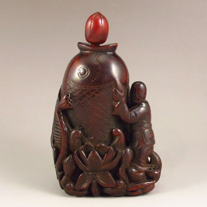 Hand Carved Chinese Ox Horn Fish Shape Snuff Bottle: Hand Carved Chinese Ox Horn Fish Shape Snuff Bottle Dimension:120*70*35(mm) 4.72*2.76*1.38(in) Weight 0.46 lbs/210 g Tips about horn sculpture Horn sculpture has a long history. The horn sculpture is 