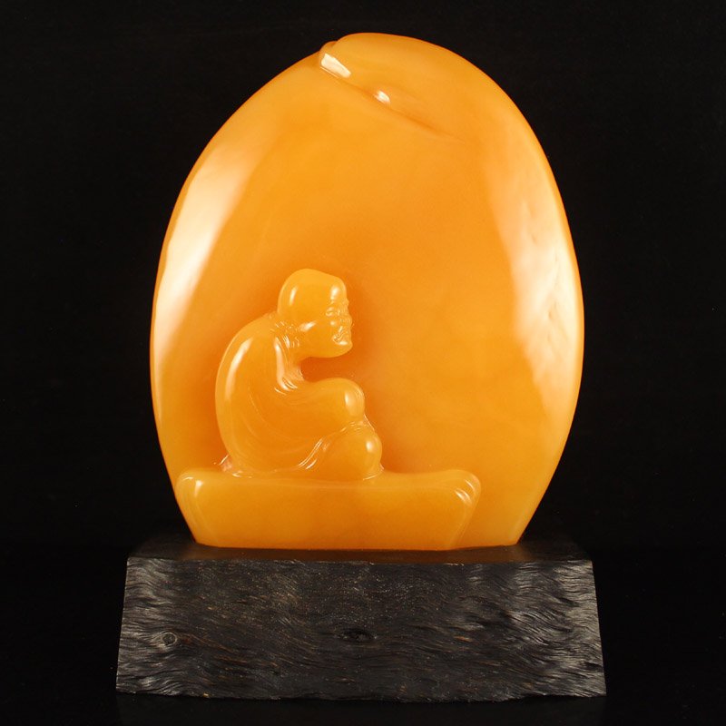 Superb Indonesia Natural Jin Tian Huang Statue - Arhat: Superb Hand Carved Indonesia Natural Jin Tian Huang Statue - Thinking Arhat Dimension: 180*140*20(mm) 7.09*5.51*0.79(in) Weight 2.63 lbs/1194 g Jin Tian Huang from Indonesia and Java Sun Xi, the stone