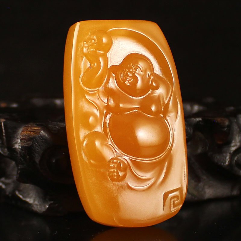 Indonesia Jin Tian Huang Pendant - Laughing Buddha: Hand Carved Natural Indonesia Jin Tian Huang Pendant - Laughing Buddha Dimension:56*32*13(mm) 2.20*1.26*0.51(in) Weight 0.10 lbs/46g Jin Tian Huang from Indonesia and Java Sun Xi, the stone in the unp