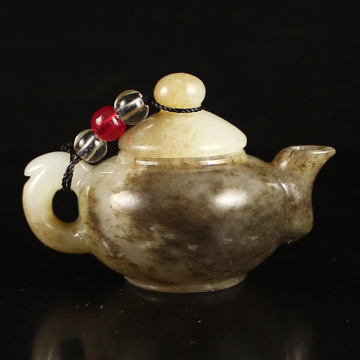 Chinese Natural Hetian Jade Teapot: Chinese Natural Hetian Jade Teapot Dimension: 59*40*38(mm) 2.32*1.57*1.50(in) Weight 0.13 lbs/57 g Tips about Chinese Hetian Nephrite Jade Hetian jade is a nephrite jade and is regarded as the only tr