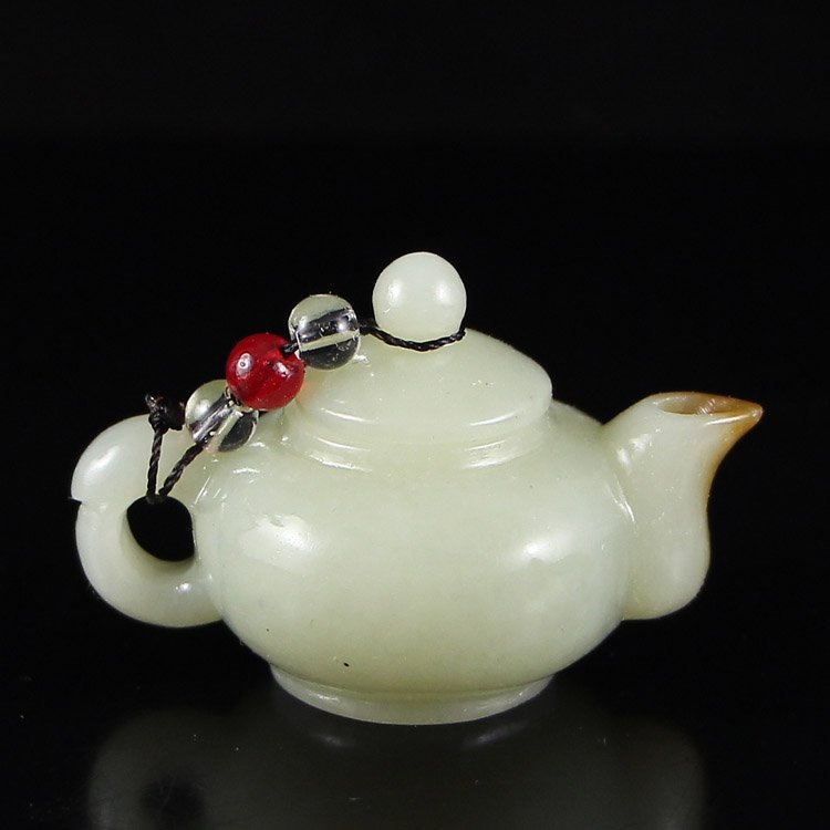 Chinese Natural Hetian Jade Teapot: Chinese Natural Hetian Jade Teapot Dimension: 59*38*37(mm) 2.32*1.50*1.46(in) Weight 0.12 lbs/54 g Tips about Chinese Hetian Nephrite Jade Hetian jade is a nephrite jade and is regarded as the only tr