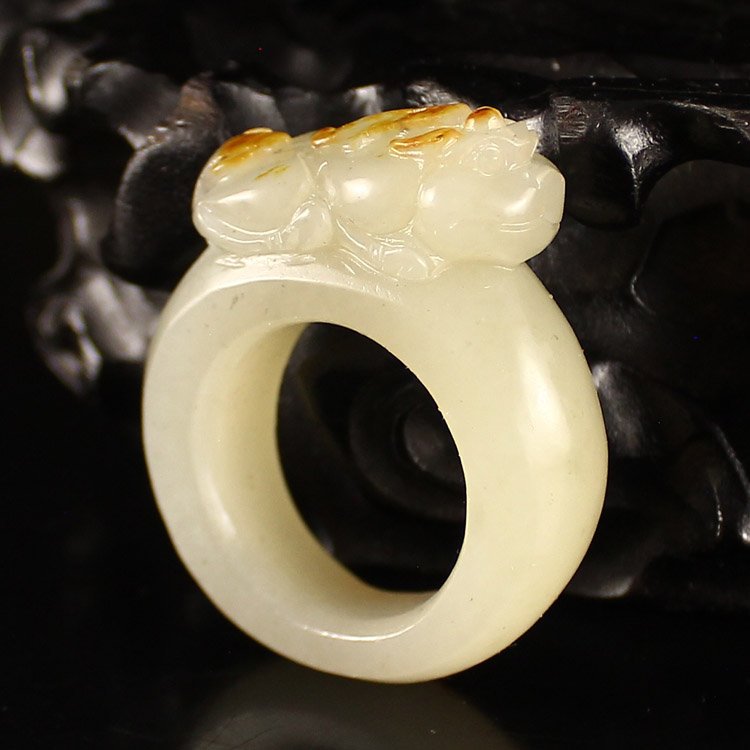 Chinese Natural Hetian Jade Fortune Pixiu Ring: Chinese Natural Hetian Jade Fortune Pixiu Ring Dimension: 23*41*13(mm) 0.91*1.61*0.51(in) Weight 0.06 lbs/25 g Tips about Chinese Hetian Nephrite Jade Hetian jade is a nephrite jade and is regarded as