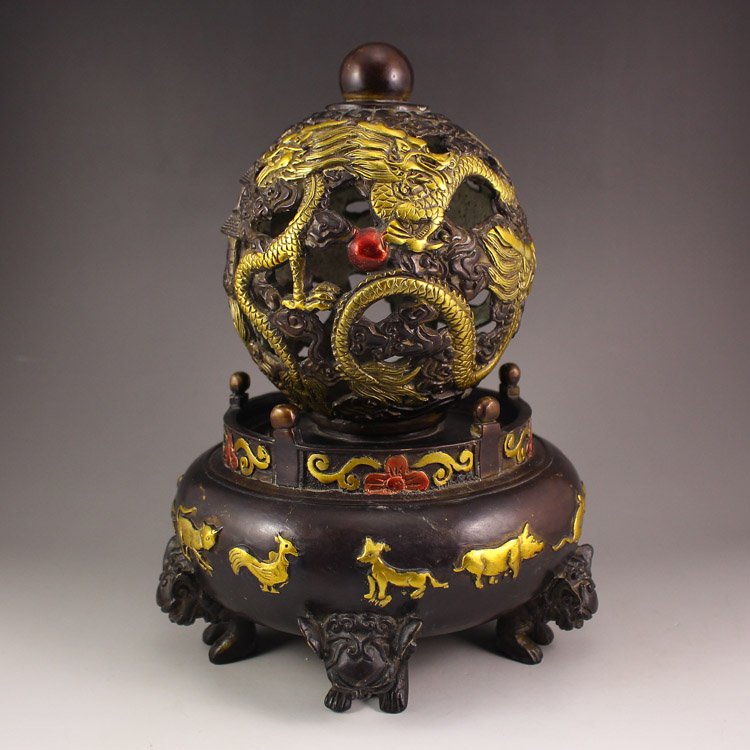 Chinese Bronze Incense Burne w Dragon & Fire Ball: Chinese Bronze Incense Burne w Dragon & Fire Ball Dimension:260*190*190(mm) 10.24*7.48*7.48(in) Weight 5.18 lbs/2349 g Tips about Bronze Bronze is some of the most important pieces of Chinese art, war