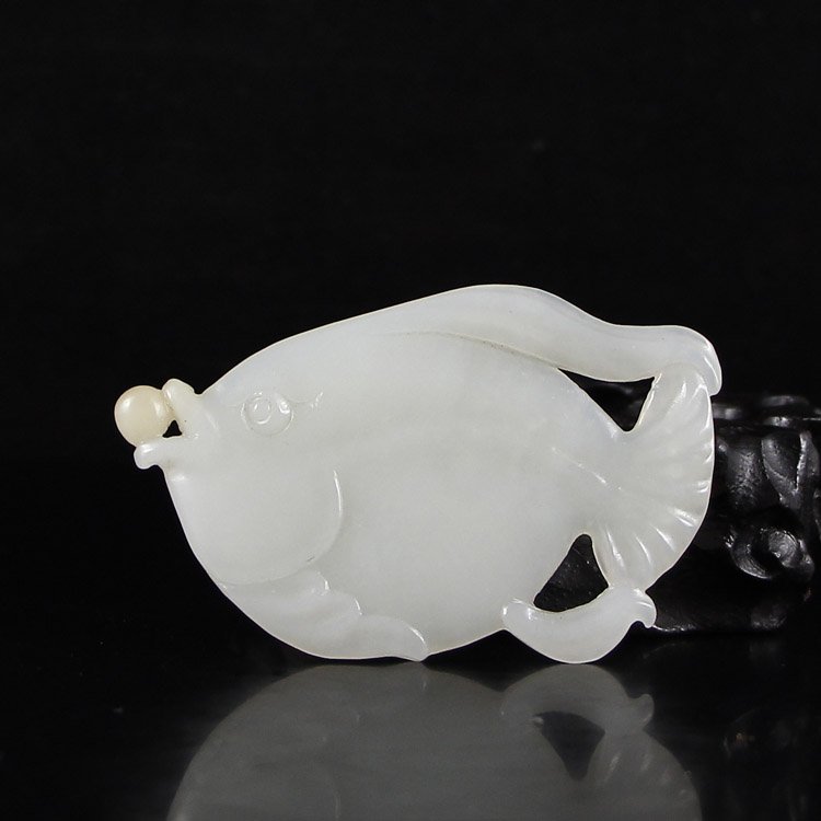 Chinese Hetian Jade Pendant - Fortune Fish: Chinese Hetian Jade Pendant - Fortune Fish Dimension: 72*46*5(mm)2.83*1.81*0.20(in) Weight 0.06lbs/26 g Tips about Chinese Hetian Nephrite Jade Hetian jade is a nephrite jade and is regarded as the on