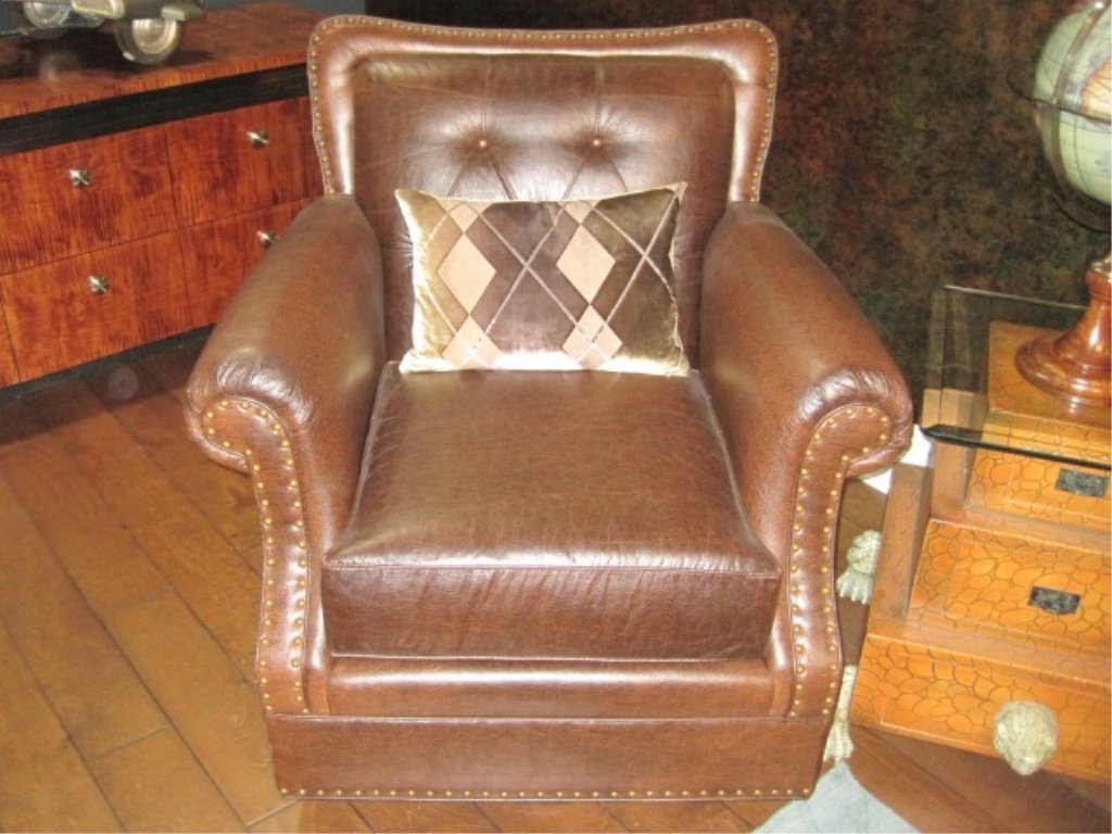 Harden Swivel Rocker: Brown distressed leather. Tufted back. Incredibly comfortable. Retail: $4,500.
